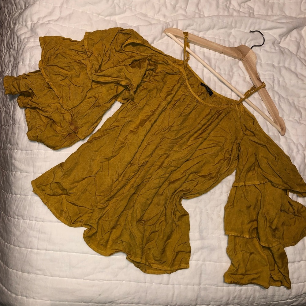 Loose mustard colored shirt